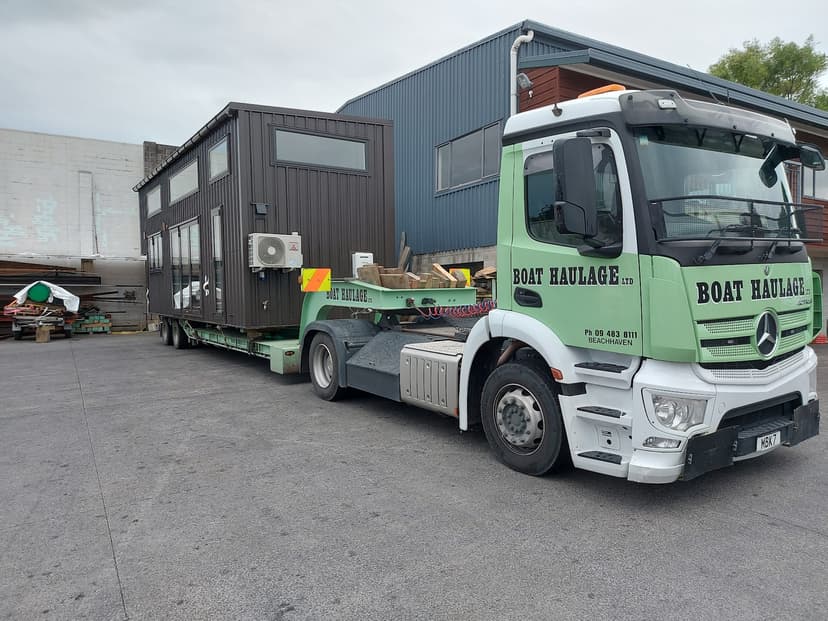 boat haulage storing large tiny home at yard