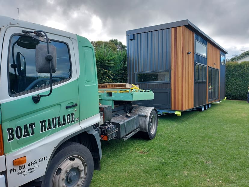 boat haulage transporting a two story tiny home New Zealand